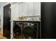 Convenient laundry area with modern appliances, stylish cabinets, and ample storage space at 8419 E Rancho Vista Dr, Scottsdale, AZ 85251