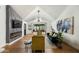 Bright living room with vaulted ceilings, modern fireplace, stylish furnishings, and large windows at 8419 E Rancho Vista Dr, Scottsdale, AZ 85251