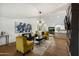 Bright living room featuring modern decor, hardwood floors, and seamless flow to the kitchen at 8419 E Rancho Vista Dr, Scottsdale, AZ 85251