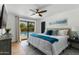 Bright bedroom with ceiling fan, outdoor access to pool, and relaxing decor at 8419 E Rancho Vista Dr, Scottsdale, AZ 85251