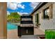 Backyard BBQ grill near pool and wall of privacy plants, ready for outdoor cooking at 8419 E Rancho Vista Dr, Scottsdale, AZ 85251