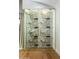 Custom wine cellar featuring glass enclosure, modern racking, and stylish design at 8419 E Rancho Vista Dr, Scottsdale, AZ 85251