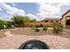 Spacious backyard featuring a putting green, fire pit and paver patio at 8804 E Ivy St, Mesa, AZ 85207