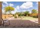 Entertainer's backyard featuring a putting green, patio, and relaxing lounge areas at 8804 E Ivy St, Mesa, AZ 85207