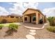 Relaxing backyard featuring a putting green, a covered patio, and xeriscaping at 8804 E Ivy St, Mesa, AZ 85207