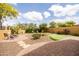 Beautiful backyard featuring a putting green, firepit and paved patio at 8804 E Ivy St, Mesa, AZ 85207