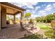 Relaxing backyard featuring a putting green, outdoor dining and BBQ at 8804 E Ivy St, Mesa, AZ 85207