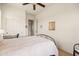 This bedroom offers a closet, ceiling fan, natural light and queen bed at 8804 E Ivy St, Mesa, AZ 85207