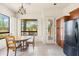 Bright breakfast nook with views of outdoor landscaping and backyard at 8804 E Ivy St, Mesa, AZ 85207