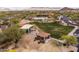 A nice community center and park with mature trees and blue swimming pool is shown in this aerial view at 8804 E Ivy St, Mesa, AZ 85207