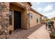 Home entrance with stone accents, desert landscaping, and a charming courtyard provides an inviting outdoor living space at 8804 E Ivy St, Mesa, AZ 85207