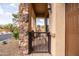 Charming gated patio with stone accents and a view of the surrounding community at 8804 E Ivy St, Mesa, AZ 85207