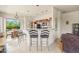 Kitchen features stainless appliances, a breakfast bar, and a large window for natural light at 8804 E Ivy St, Mesa, AZ 85207