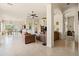 Bright and open living room with tile flooring, neutral walls, and seamless flow to the dining and kitchen areas at 8804 E Ivy St, Mesa, AZ 85207