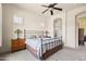 Tranquil main bedroom with a ceiling fan and ensuite bathroom at 8804 E Ivy St, Mesa, AZ 85207