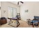 Office featuring a window with plantation shutters, desk, comfortable chair, and side table at 8804 E Ivy St, Mesa, AZ 85207