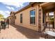 Outdoor patio with brick pavers, stone accents, and comfortable seating areas perfect for outdoor living at 8804 E Ivy St, Mesa, AZ 85207