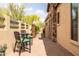 Cozy outdoor patio with stone accents, brick pavers, and a comfortable seating area offers private outdoor relaxation at 8804 E Ivy St, Mesa, AZ 85207