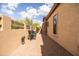 Outdoor patio with brick pavers, neutral walls, and comfortable seating areas perfect for outdoor dining at 8804 E Ivy St, Mesa, AZ 85207