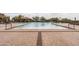 A clear pool offers ample space for swimming and relaxation, surrounded by comfortable seating and desert views at 8804 E Ivy St, Mesa, AZ 85207