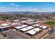 Aerial view showcases a large school complex with athletic fields in a well-established community at 9110 W Palm Ln, Phoenix, AZ 85037
