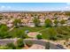 Community aerial showcases a lush park, playground, and walking trails, surrounded by residential homes at 9110 W Palm Ln, Phoenix, AZ 85037