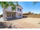View of backyard featuring the covered patio and a yard area ready for landscaping and customization at 9110 W Palm Ln, Phoenix, AZ 85037