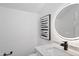 Modern bathroom features sleek vanity, elegant lighting, and a stylish design at 9110 W Palm Ln, Phoenix, AZ 85037