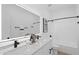Stylish bathroom with double sink vanity, modern fixtures, and shower-tub combination at 9110 W Palm Ln, Phoenix, AZ 85037