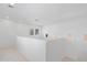 Bright hallway with high ceilings and natural light from multiple windows at 9110 W Palm Ln, Phoenix, AZ 85037