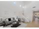 Bright living room with high ceilings and a cozy seating area with modern decor at 9110 W Palm Ln, Phoenix, AZ 85037