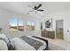 Spacious main bedroom with a large window, modern decor, and ample natural light at 9110 W Palm Ln, Phoenix, AZ 85037