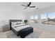 Serene main bedroom with large windows and a comfortable seating area at 9110 W Palm Ln, Phoenix, AZ 85037