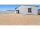 Picture of a backyard with desert landscaping, block fencing, and a covered patio at 9547 W Parkway Dr, Tolleson, AZ 85353