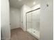 Modern bathroom featuring a glass-enclosed shower, tile floors, and a neutral color scheme for a clean aesthetic at 9547 W Parkway Dr, Tolleson, AZ 85353