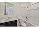 Bright bathroom featuring a shower and vanity with sink at 9547 W Parkway Dr, Tolleson, AZ 85353