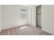 Bedroom with closet, window, and carpet flooring at 9547 W Parkway Dr, Tolleson, AZ 85353