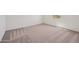 Spacious bedroom with a window and carpet flooring at 9547 W Parkway Dr, Tolleson, AZ 85353