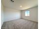 Bright bedroom with carpeted floors, a large window, and plenty of space for furnishings at 9547 W Parkway Dr, Tolleson, AZ 85353
