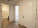 Bright entryway showcasing a tiled floor with views of a bathroom and bedroom at 9547 W Parkway Dr, Tolleson, AZ 85353