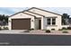 Charming single-story home with a two-car garage and desert landscaping at 9547 W Parkway Dr, Tolleson, AZ 85353