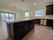 Stylish kitchen featuring an island, stainless steel appliances, and an open layout at 9547 W Parkway Dr, Tolleson, AZ 85353