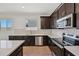 Well-equipped kitchen featuring stainless steel appliances and stylish tile backsplash at 9547 W Parkway Dr, Tolleson, AZ 85353