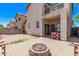 Backyard patio featuring a fire pit, adjacent to an elevated balcony, great for relaxing outdoors at 10225 W Camelback Rd # 3, Phoenix, AZ 85037