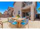An outdoor dining set for six sits on the backyard patio, close to the house at 10225 W Camelback Rd # 3, Phoenix, AZ 85037
