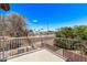 A private balcony offers views of the neighborhood and palm trees in the distance at 10225 W Camelback Rd # 3, Phoenix, AZ 85037