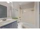 Bathroom with a tub and shower, tile flooring, and a vanity at 10225 W Camelback Rd # 3, Phoenix, AZ 85037