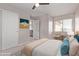 Bedroom with a ceiling fan, window, and decorated with a print at 10225 W Camelback Rd # 3, Phoenix, AZ 85037