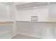 Walk-in closet with ample shelving and a 'thankful' sign for decor at 10225 W Camelback Rd # 3, Phoenix, AZ 85037