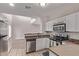 Bright kitchen with stainless steel appliances and a breakfast bar perfect for entertaining at 10225 W Camelback Rd # 3, Phoenix, AZ 85037